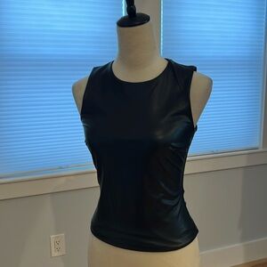 Body contouring  faux leather top.